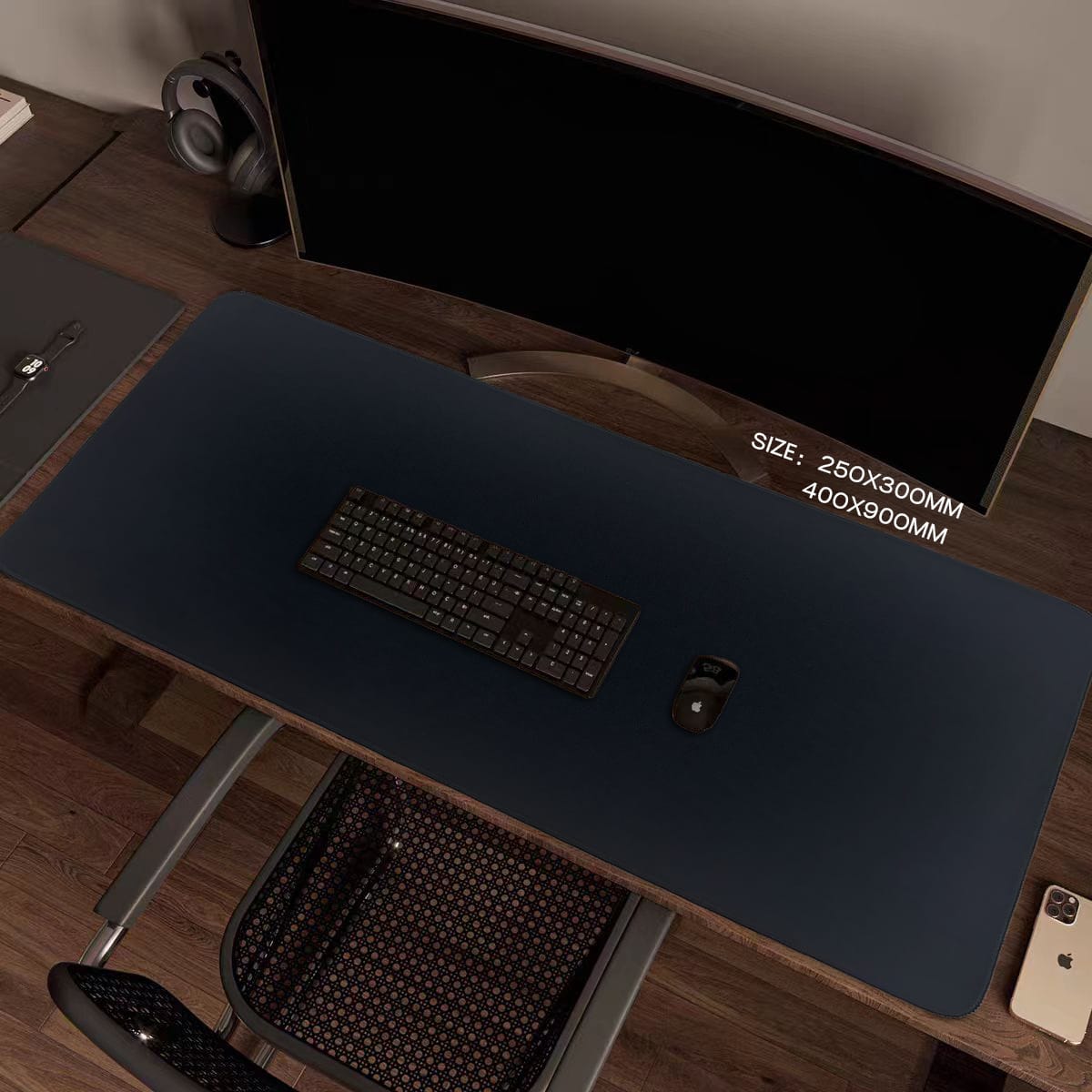 Plain large desk mat photographed in a workstation setup